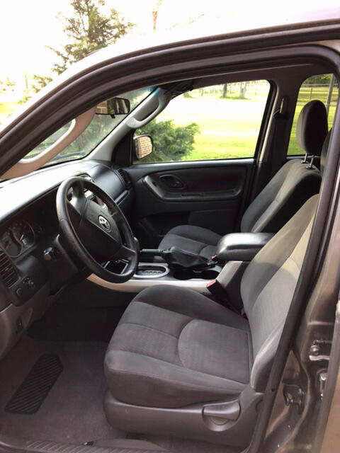 Back seat, loose vinyl on door visible