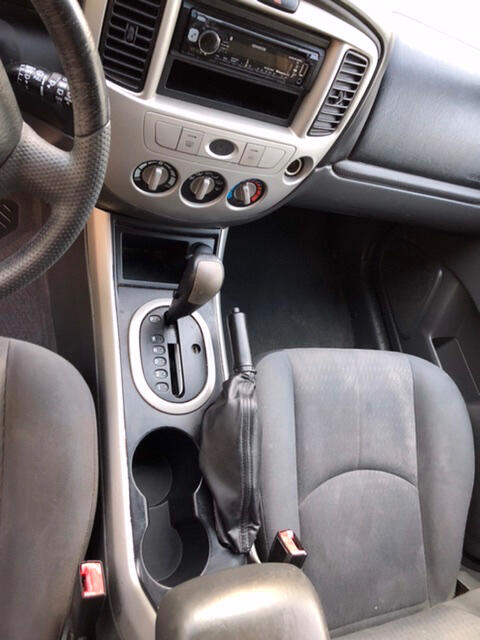 Back seat, loose vinyl on door visible