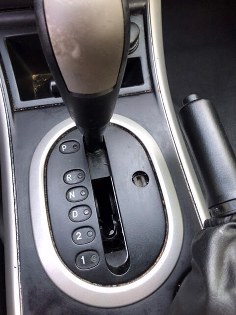 Vinyl by gear shifter has dry-rotted